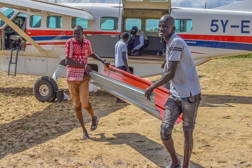 Unloading the roofing sheets from the MAF plane 