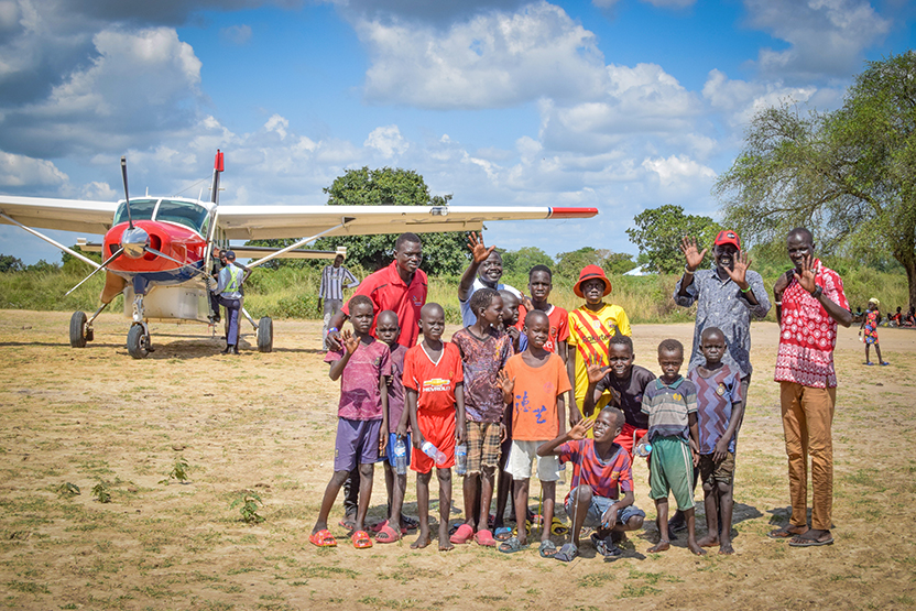 Children from the community come to meet the MAF plane 