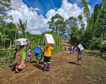 locals from remote Sindeni village carrying the mdical supplies to the health center