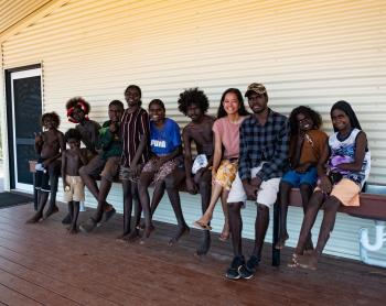 Teacher and students sitting outside Gawa school