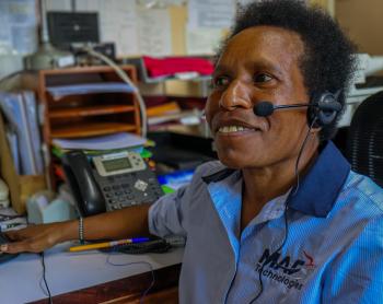 A woman using a radio headset