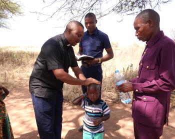 Eric Dadi being baptized