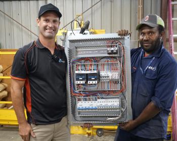 Electricians work on upgrading the generator