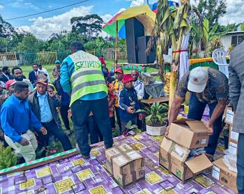 Pastors and youth from CAF Church distributing Bibles among participants during the National Youth Conference.