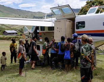 Offloading the vaccine fridge and solar panels