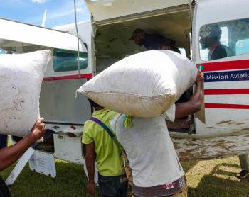 Loading bags onto the MAF plane