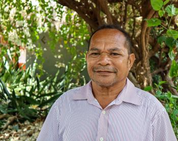A man smiles at the camera