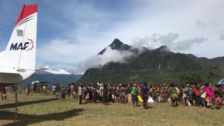 A huge crowd welcomes the first operational flight into Yalum