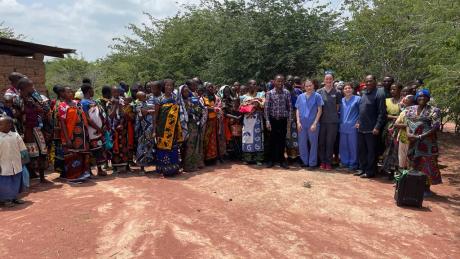 Mothers pose with the medical and evangelist during a mobile clinic at Dabia.