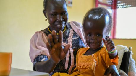 Four-year-old Raya Rose and her grandmother Estherina are being helped by OVCI