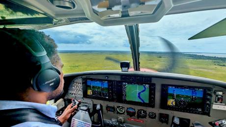 Ricky Poki flying MAF Plane delivering services to the remote communities around Balimo.