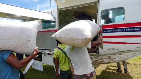 Loading bags onto the MAF plane