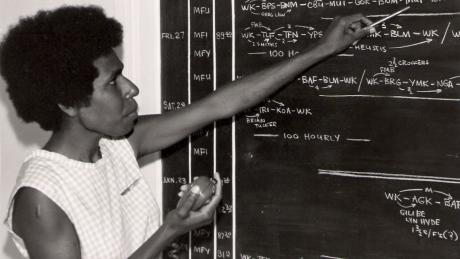 A woman using a radio handset