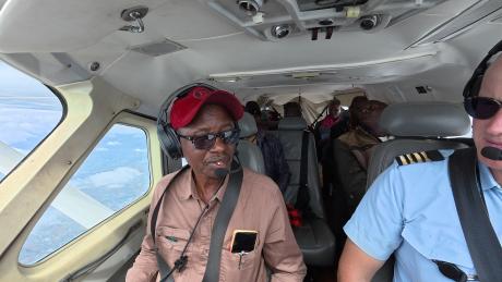 Evangelist Elisha Moita and pilot Peter Griffin in the cockpit of Cessna 208