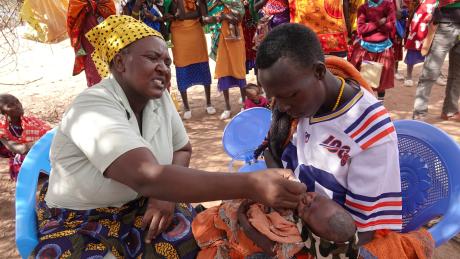 Baby Maiko receives his first vaccinations