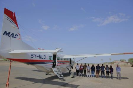 CURE medical team with MAF Kenya Pilot Sam Johnston at Lodwar airstrip