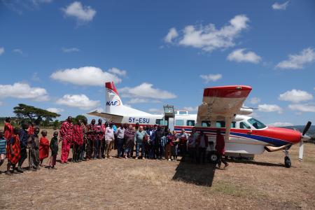 Veterinary doctors from the United States of America, pose for a photo with the Maasai after landing at Enairebuk airstrip.          