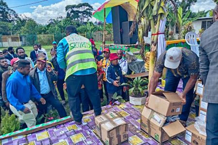 Pastors and youth from CAF Church distributing Bibles among participants during the National Youth Conference.
