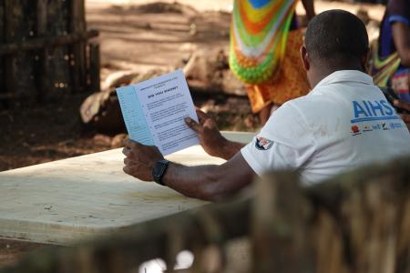 Raising awareness: a health worker educates the Yambaitok community during the health patrol.