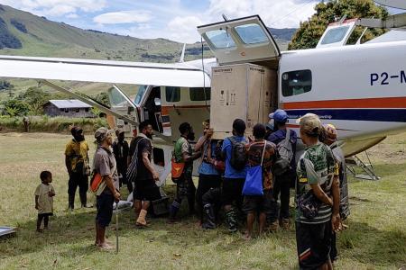 Offloading the vaccine fridge and solar panels