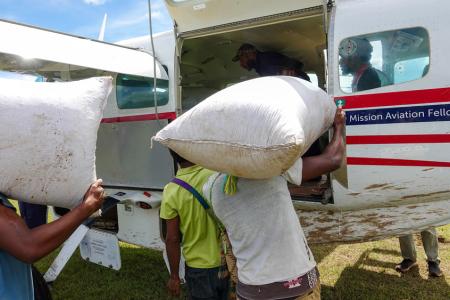 Loading bags onto the MAF plane
