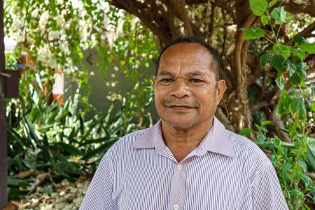 A man smiles at the camera