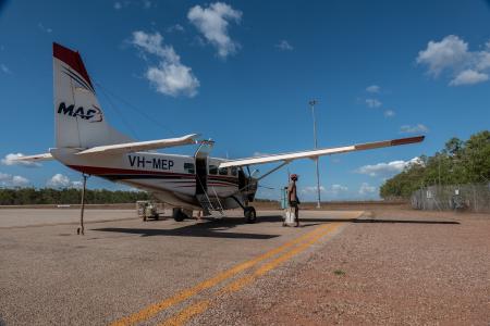 Cessna caravan on concrete tarmac in bright sunlight 