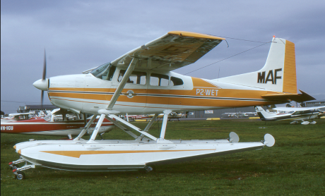 P2-WET, a Cessna 182 in the yellow-brown livery of MAF 