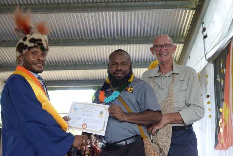 William Denipo receiving his awards from Western Province Governor, Hon Taboi Awi Yoto