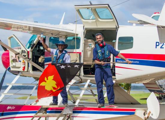 Joseph Tua and Titus Oaeke celebrate Independence on the float plane floats