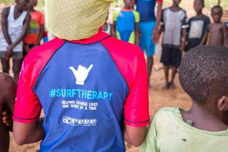 "Helping change lives one wave at a time " uniform