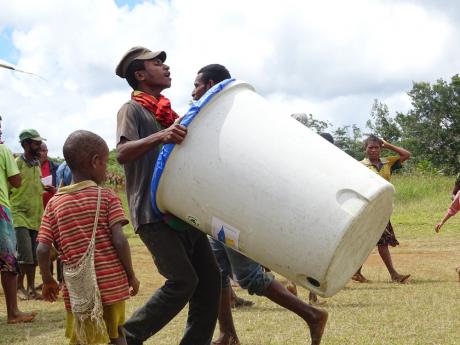 Local carrying a rain catcher unit