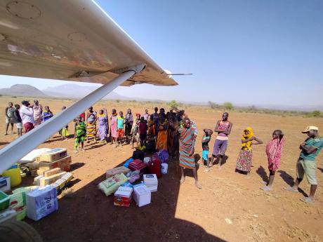 people under aircraft wig