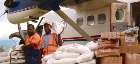 Loading relief supplies into the MAF aircraft for delivery to communities devastated by flooding in the Southern Highlands of Papua New Guinea.