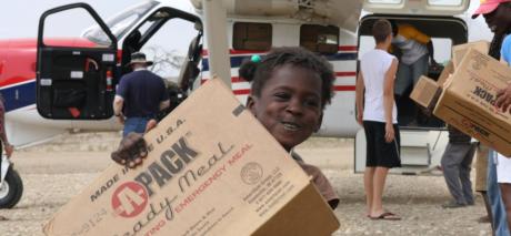 Unloading relief supplies from a MAF plane following the 2010 earthquake in Haiti