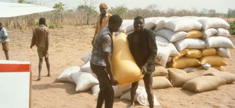 Sacks of food being unloaded from the MAF aircraft to provide vital relief during a time of severe famine in Chad.