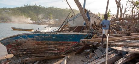 2016 Children playing amidst the hurricane debris in Dame Marie, Haiti