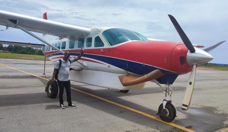 Country Director of JAM, Fred Mutenyo with the aircraft