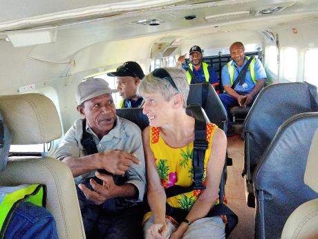 Rosie Crowter and Mase Wodia on board a MAF flight to Kiunga