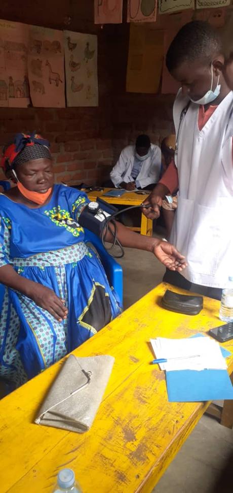 Person having their blood pressure taken