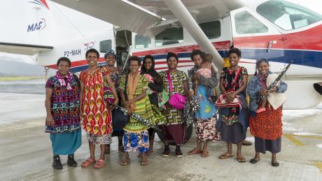 one of three groups of EBC Pastor's women posing in front of the aircraft prior to departing Mt Hagen for Wewak