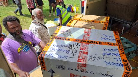 unloading vaccine boxss at Simbai