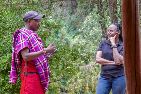 Pelua Siloma, the RedTribe Country Director having a conversation with Susan Kolum, the MAF Kenya Country Director at Enairebuk.