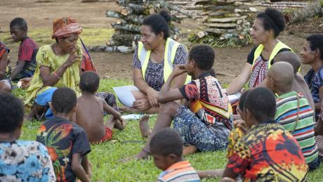 Betty talking with the villagers