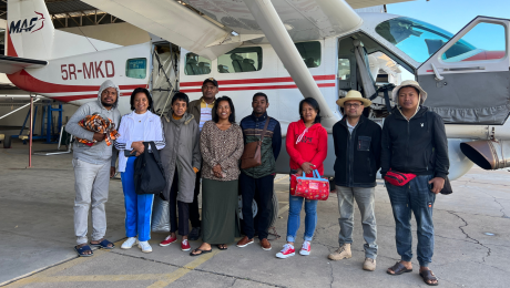 MMS team in MAF hangar in front of Cessna 208