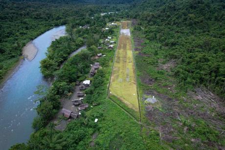 Aerial view shot of the Fiyak airstrip beside the May river.