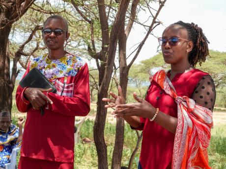 Magdalena, a social worker from Maternity Africa alongside evangelist Elisha during a training session at Lemugur.