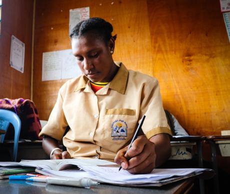 Craydola doing her school work during class time