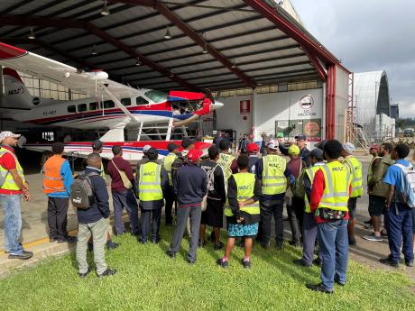 grade 12 students learning about the floatplane and MAF's maintenance facility