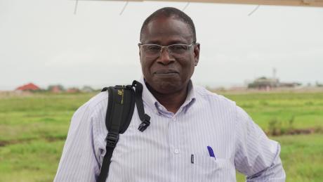 Moussa Dominique resident representative of Catholic Relief Services and two other CRS officials at his sides 